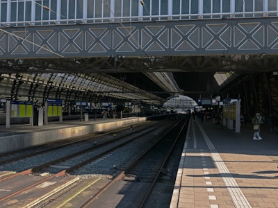 a train station with a train on the tracks