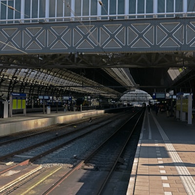 a train station with a train on the tracks