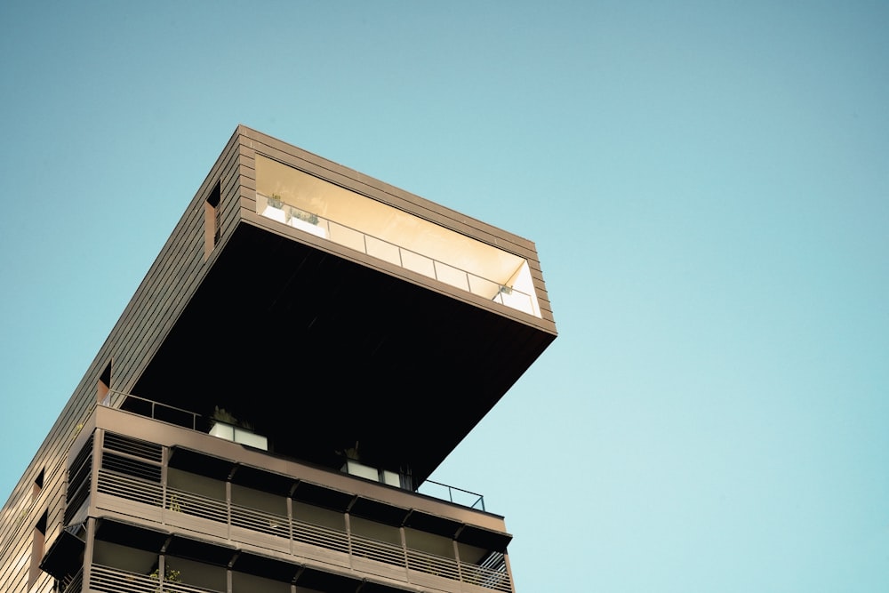 a tall building with balconies on top of it