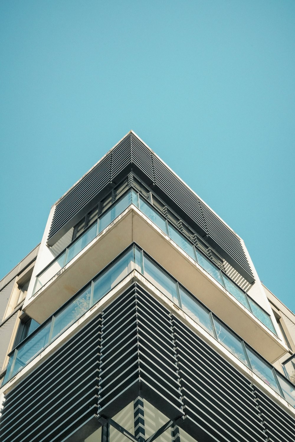 the top of a tall building with a sky background