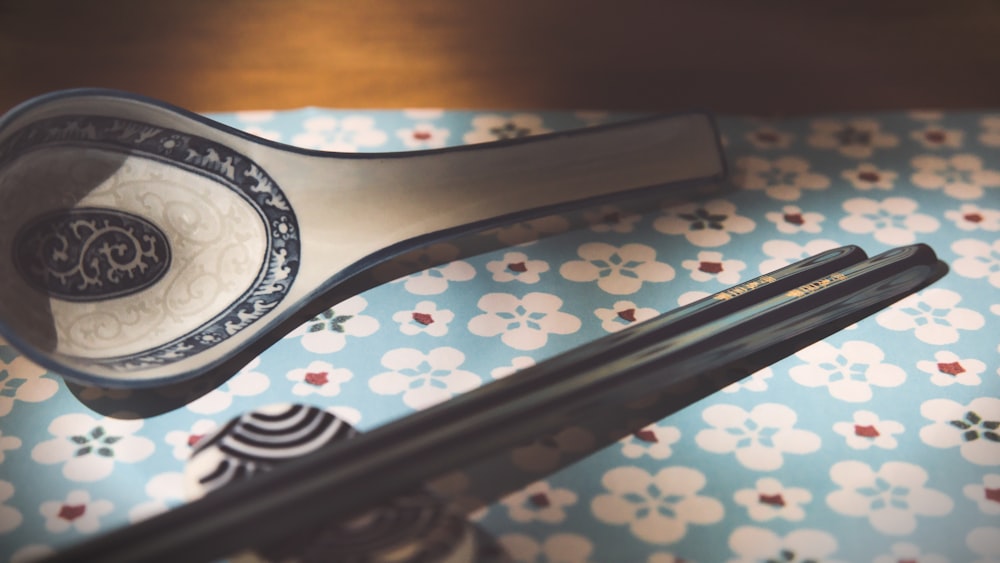 a pair of chopsticks sitting on top of a table