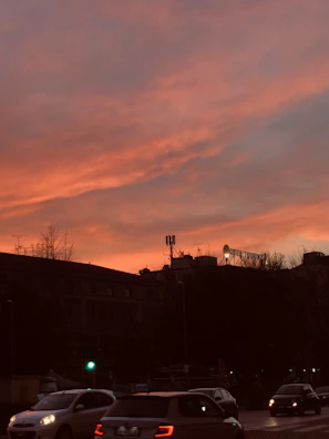 Sunset casting warm light on terracotta rooftops and palm trees in Antalya.