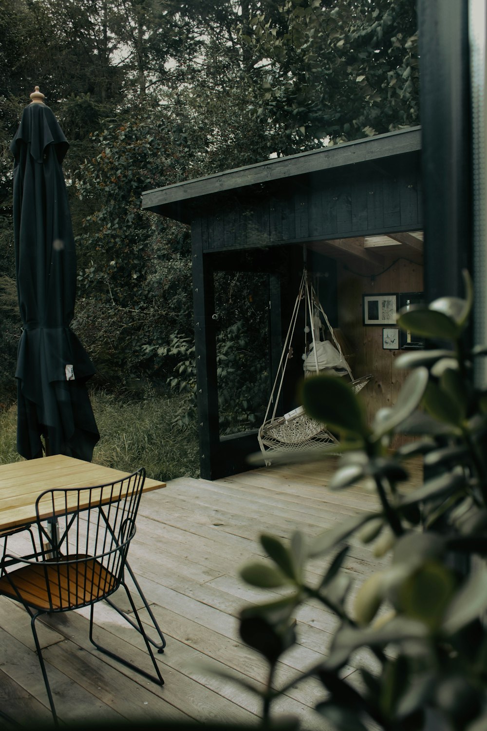 a wooden deck with a table and chairs