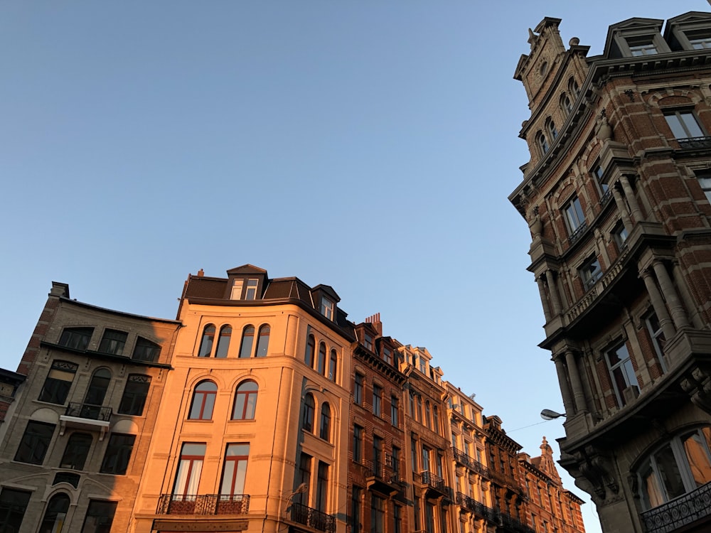 a tall building sitting next to other tall buildings