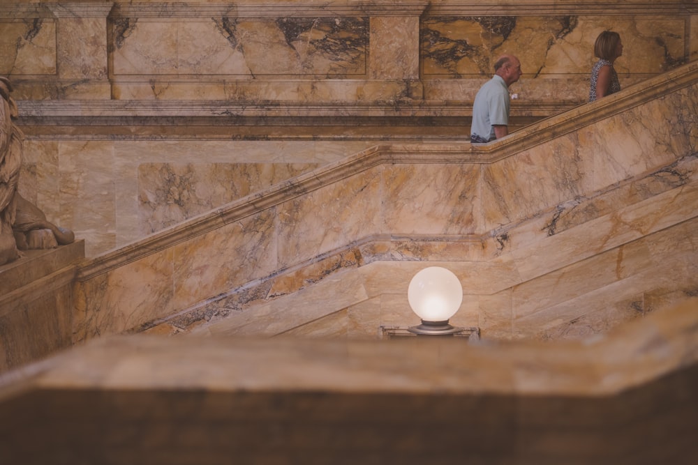 a couple of people standing on a set of stairs