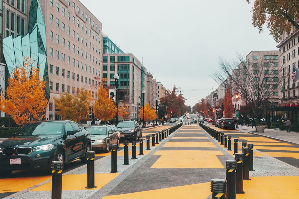 a city street with cars parked on both sides of the street