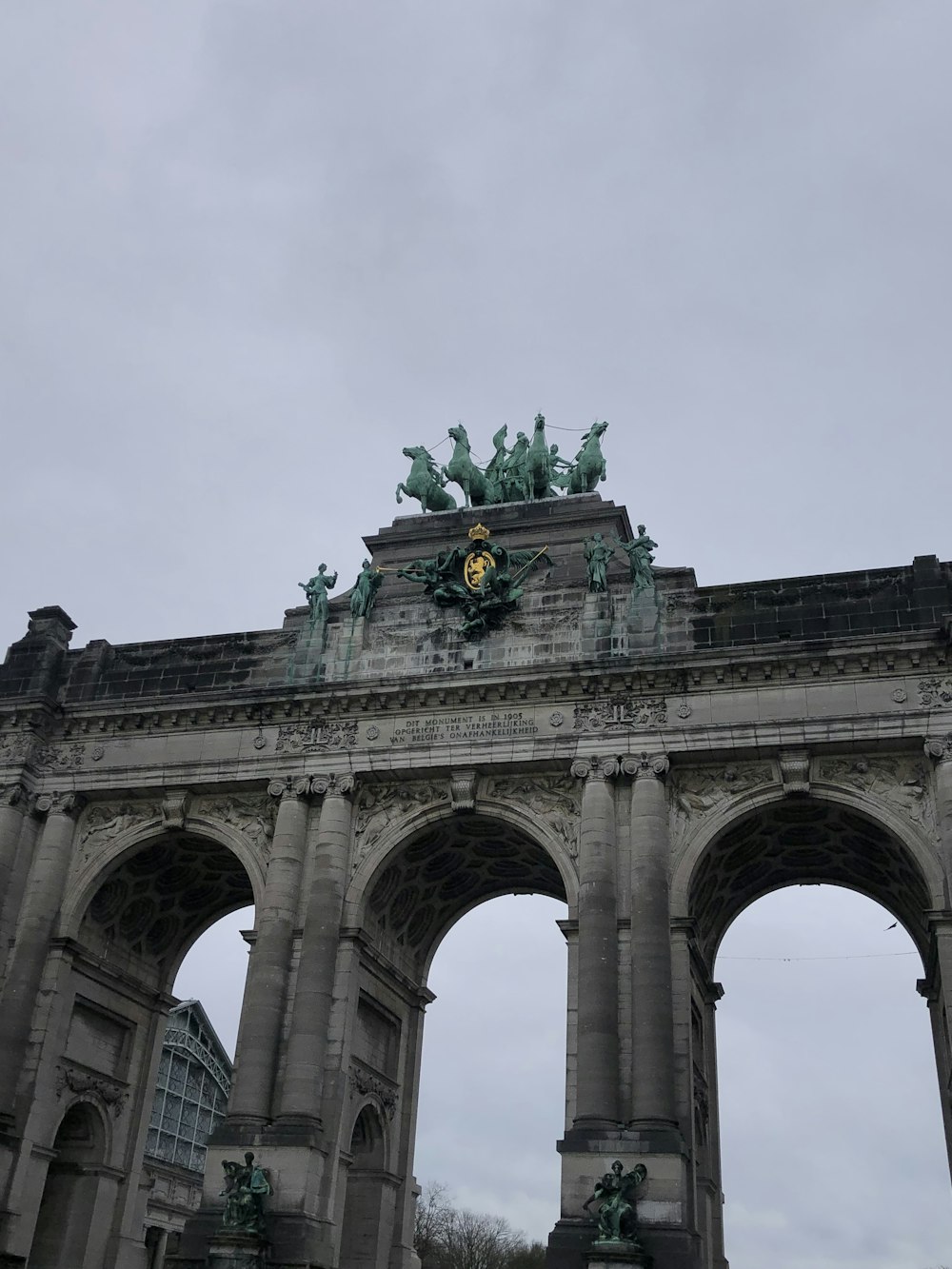 a large arch with statues on top of it