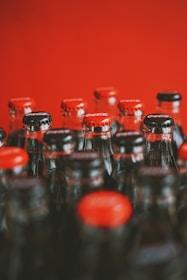 a close up of many bottles of soda