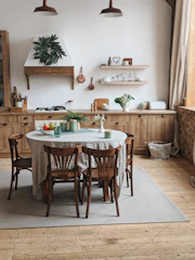 A cozy family kitchen with warm earth tones and inviting seating.