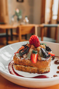 a piece of cake with fruit on top of it