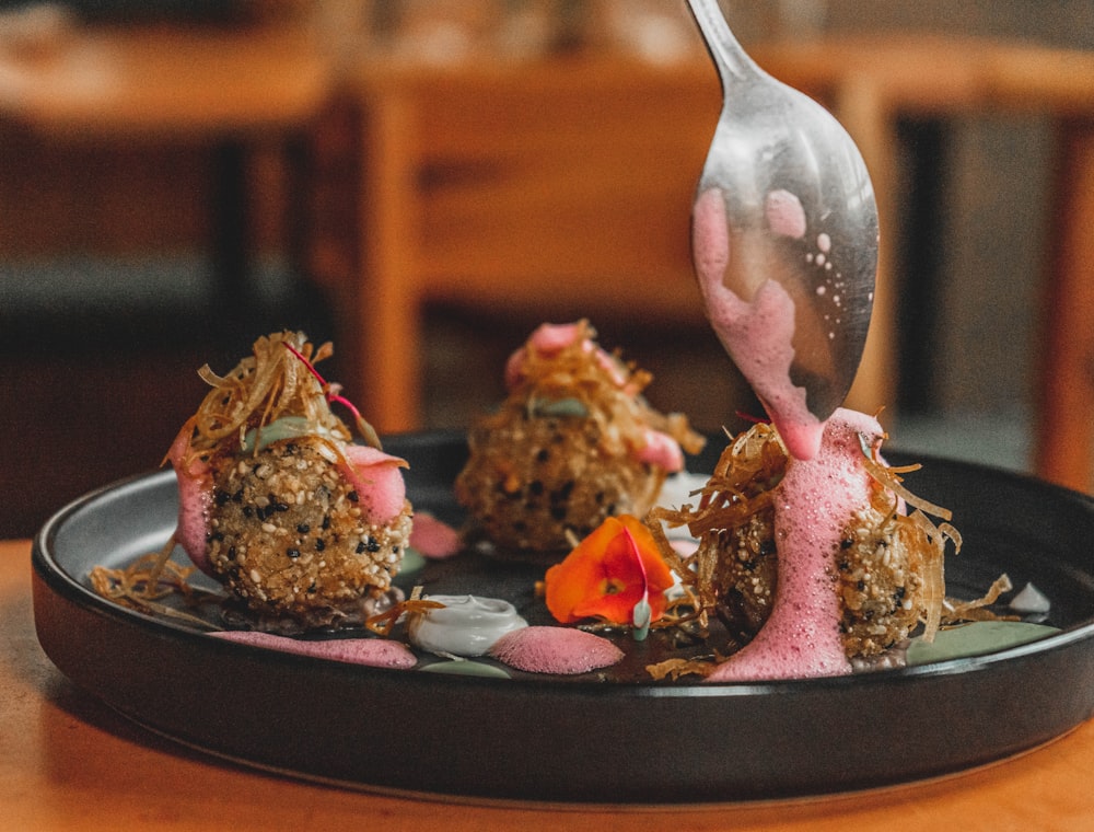 a plate of food with a spoon sticking out of it