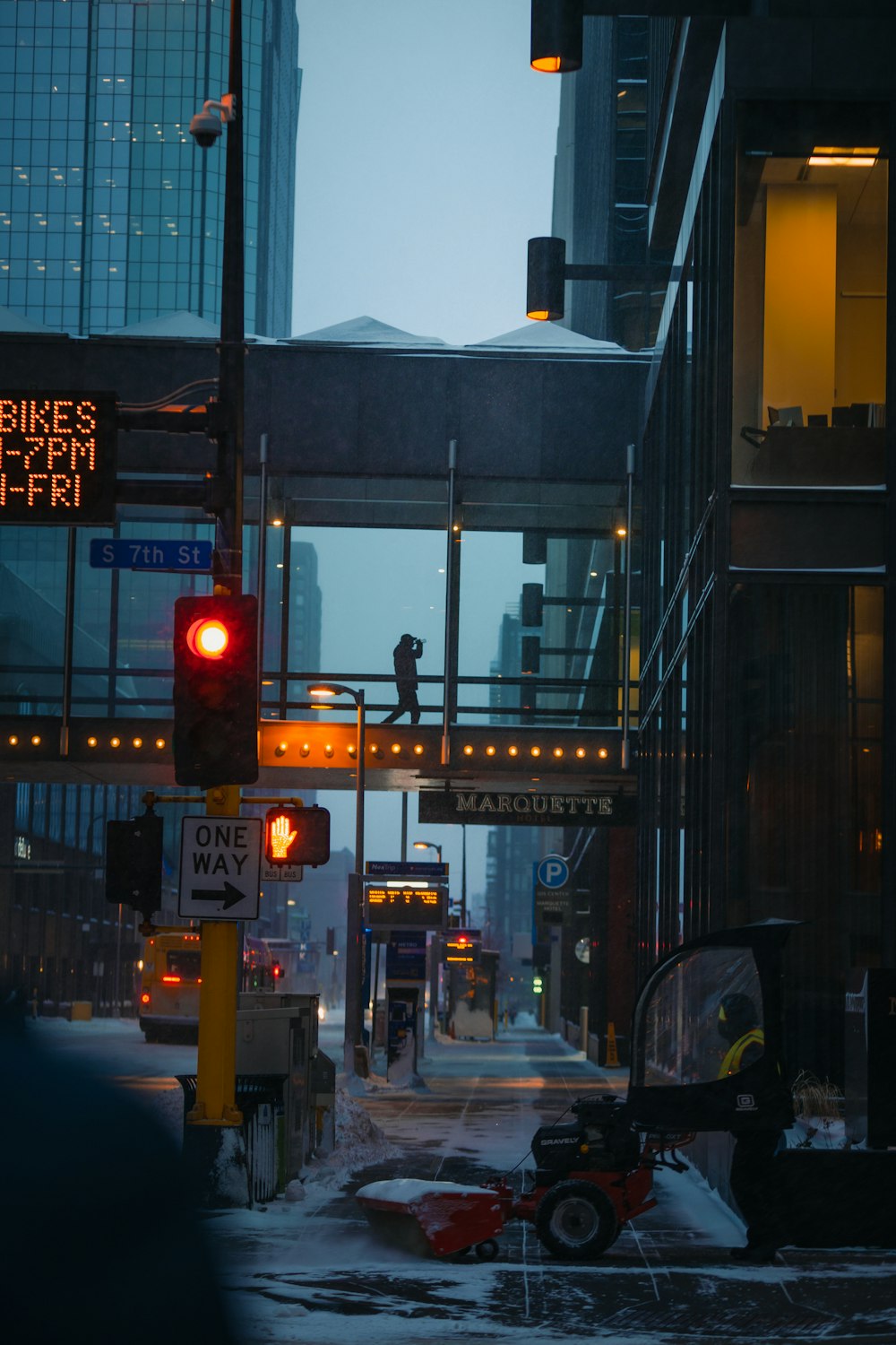 a city street with a traffic light and street signs