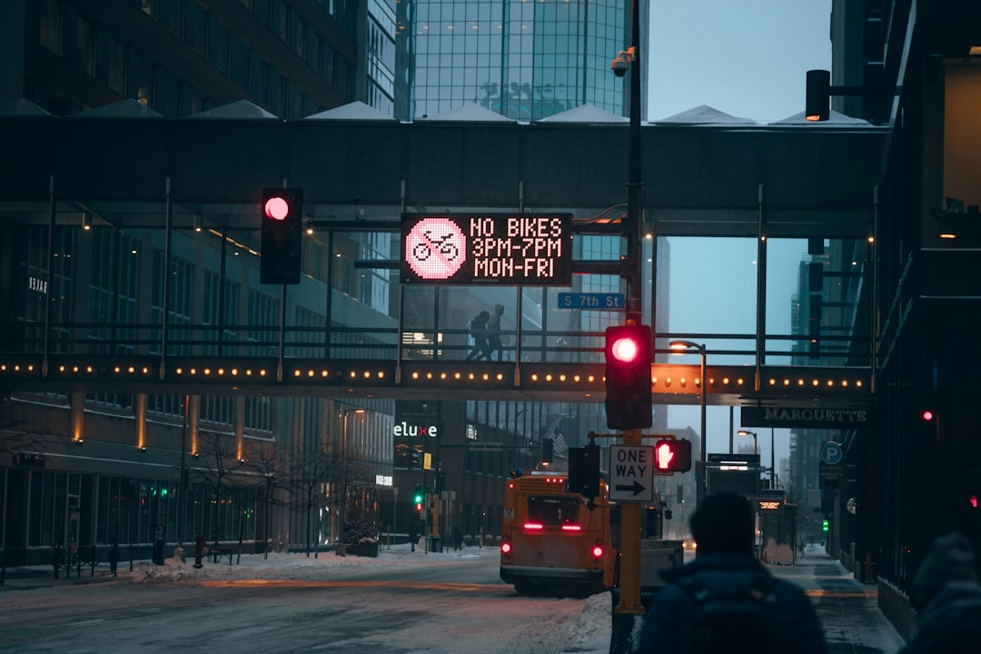a red traffic light sitting on the side of a road,