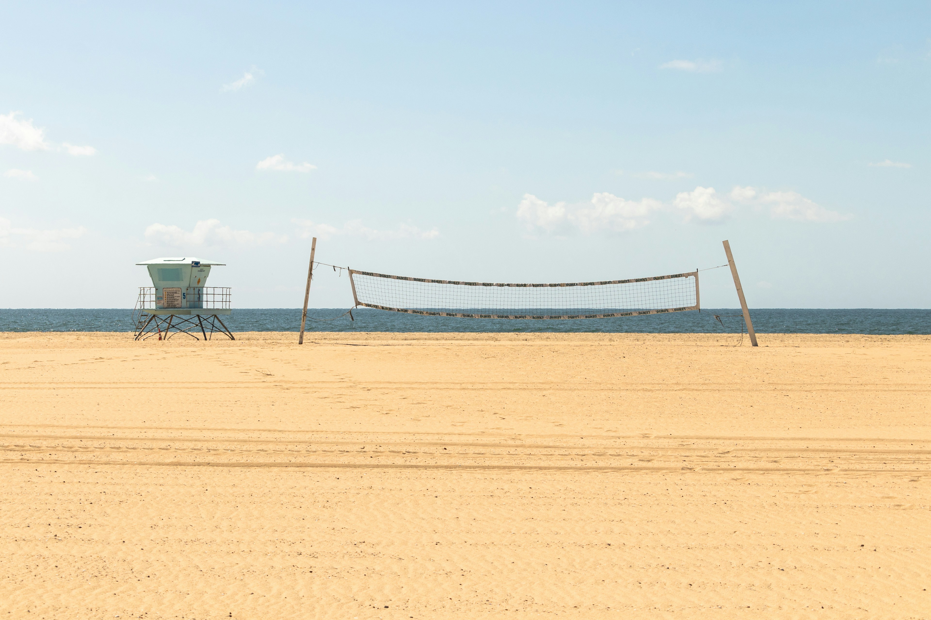a-volleyball-court-with-a-net-on-the-beach-photo-free-huntington