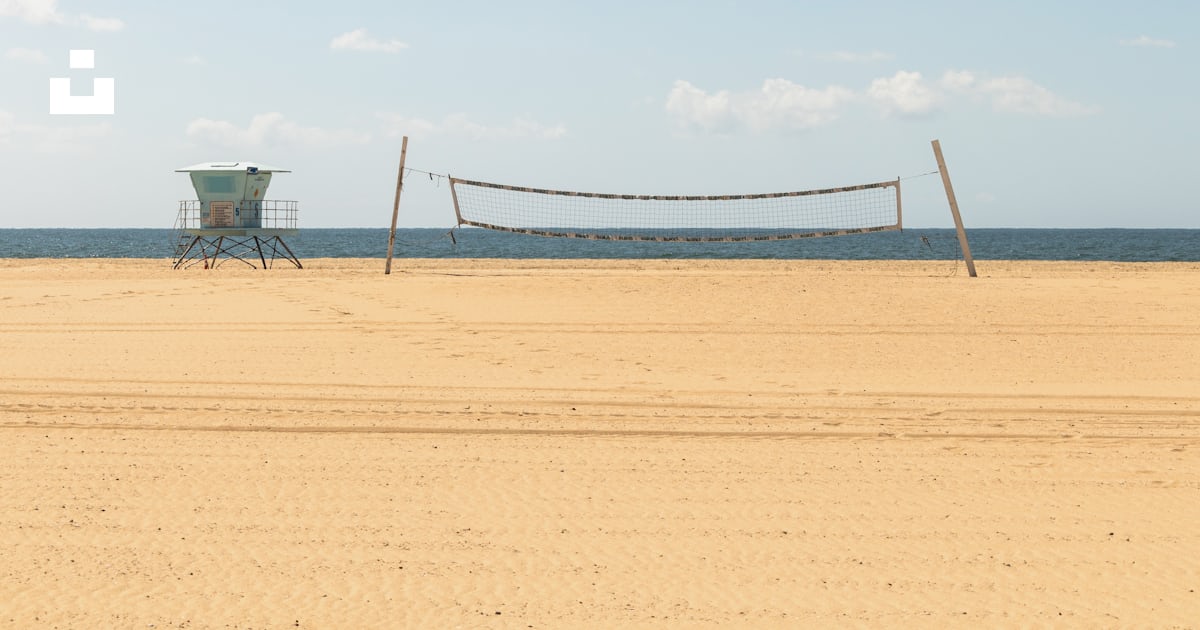 A Volleyball Court With A Net On The Beach Photo Free Huntington a-volleyball-court-with-a-net-on-the-beach-photo-free-huntington