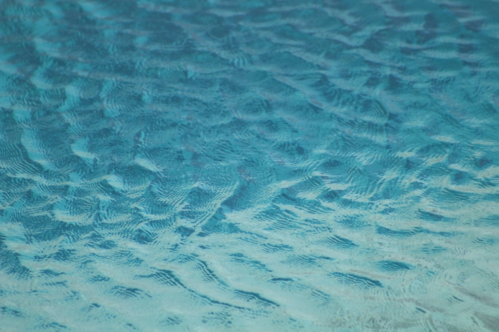 a close up of a blue water surface with ripples