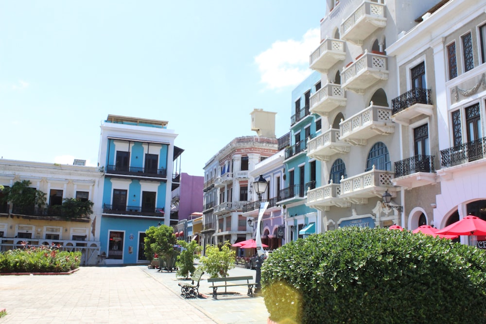 a row of multi - colored buildings on a sunny day