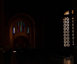 A warm, inviting space with soft light filtering through stained glass, symbolizing connection and peace.