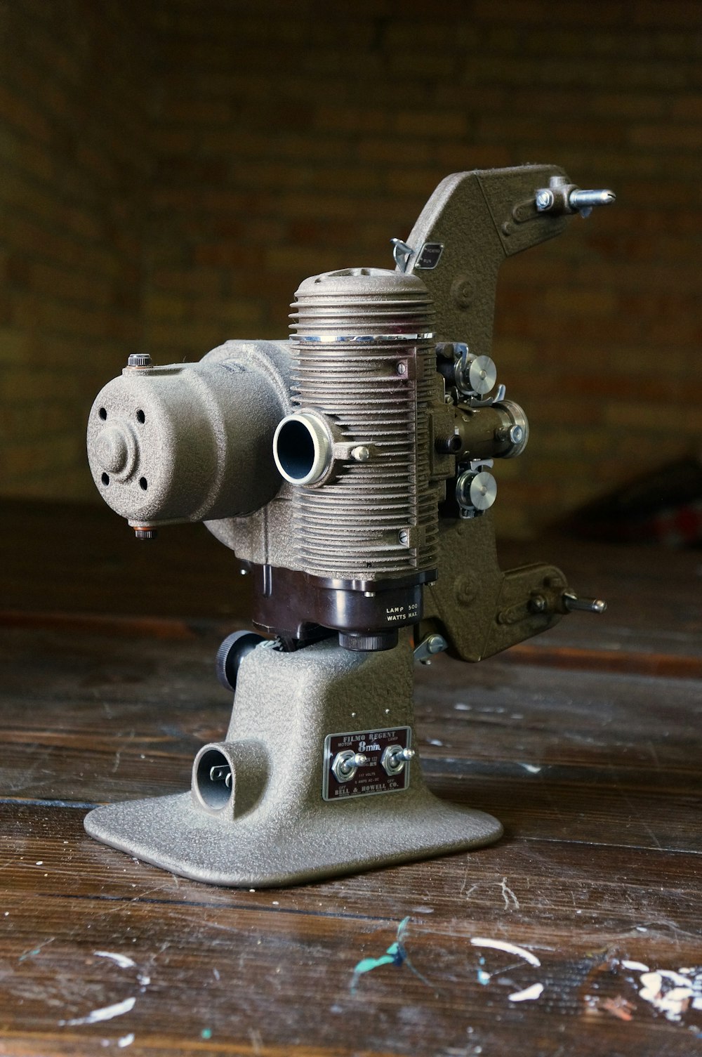 a metal object sitting on top of a wooden table