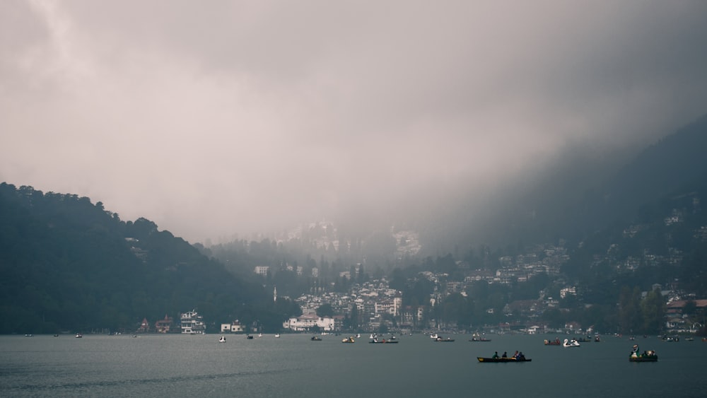 a group of boats floating on top of a lake