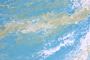 a painting of a blue and yellow ocean