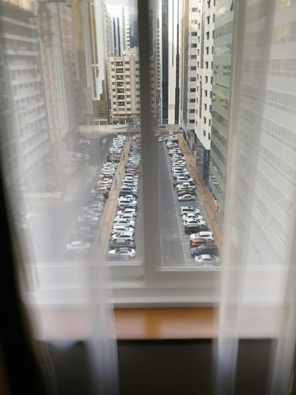 a view of a parking lot through a window