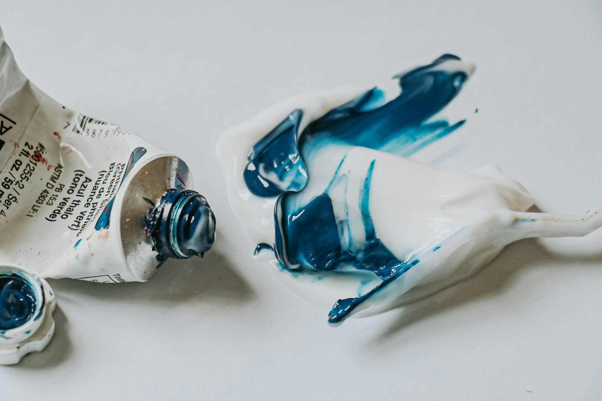 a bottle of paint sitting on top of a table