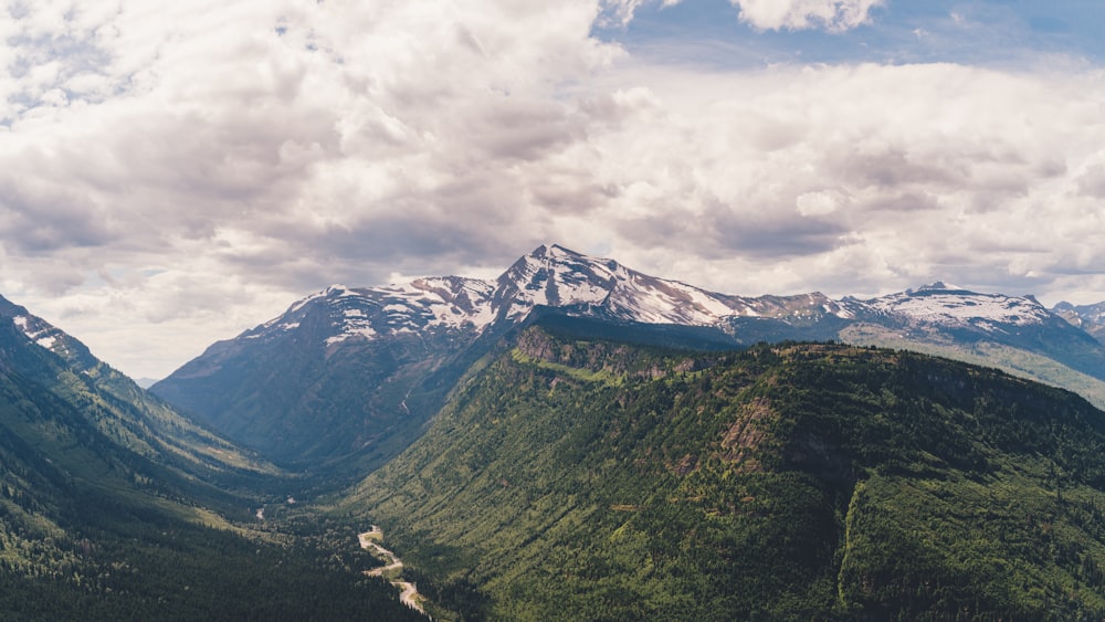 a view of a valley with mountains in the background