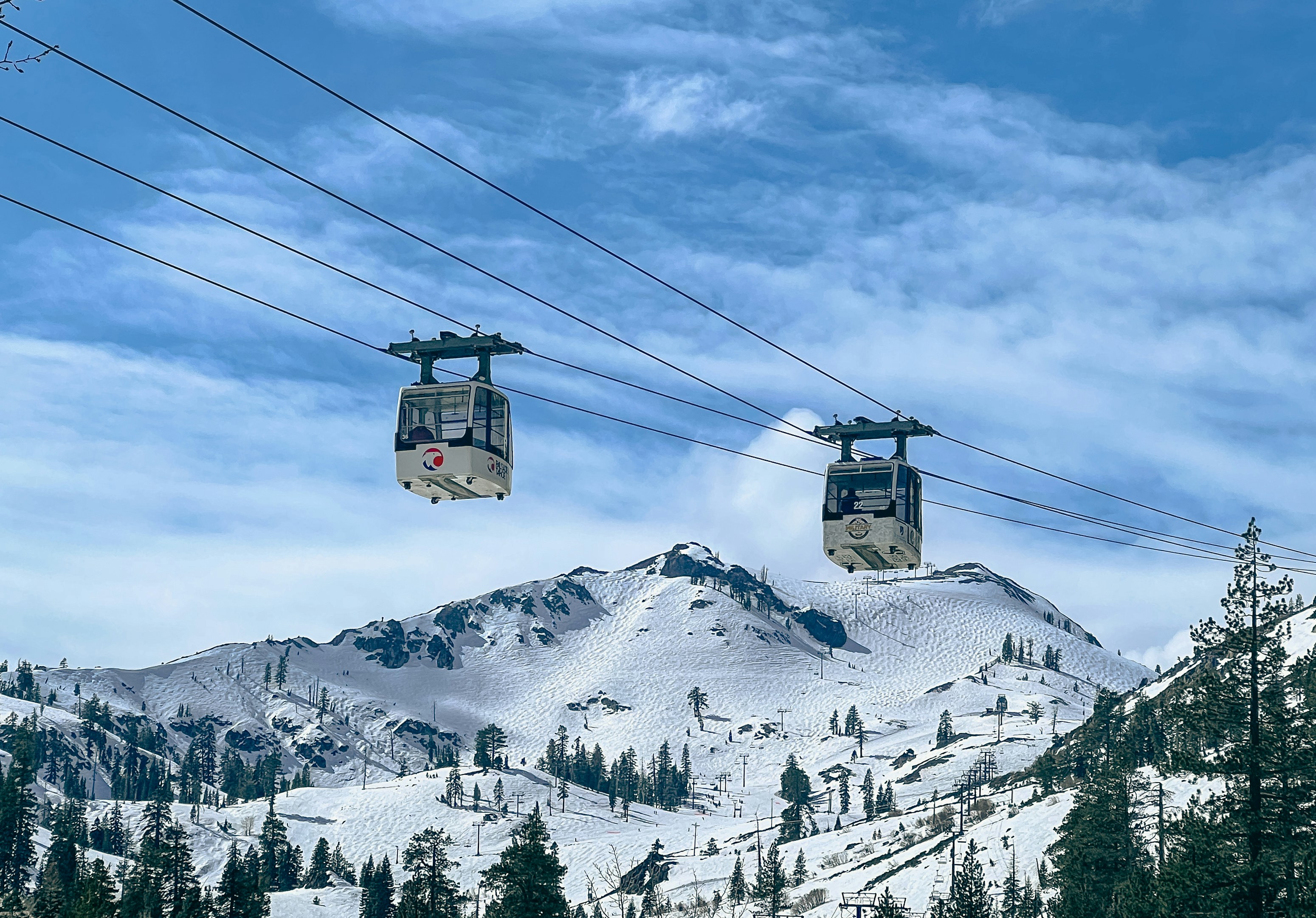 Snow-covered Lake Tahoe ski resort with mountain views in spring, signaling end of ski season 2025