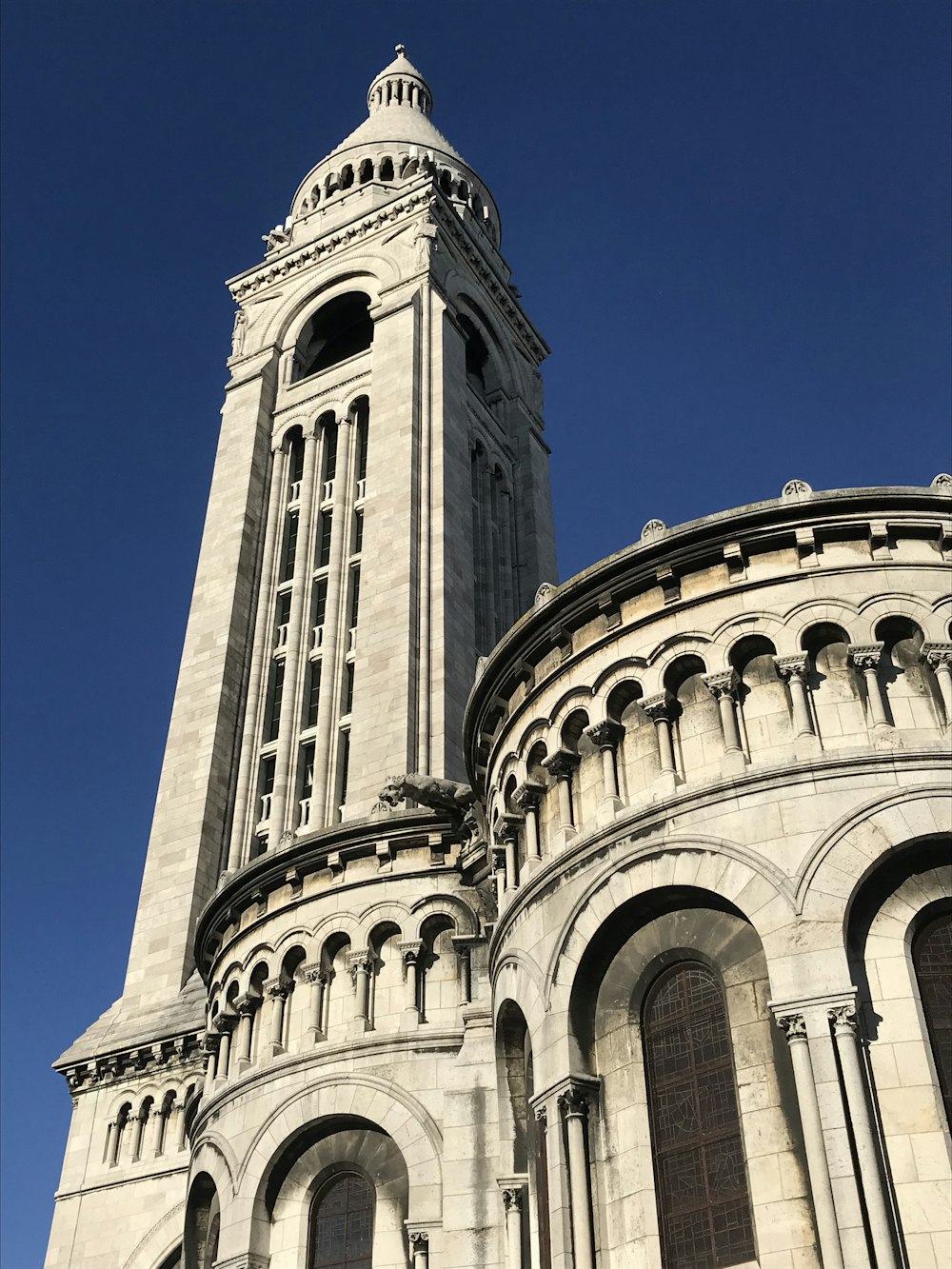 a very tall building with a clock on it's side