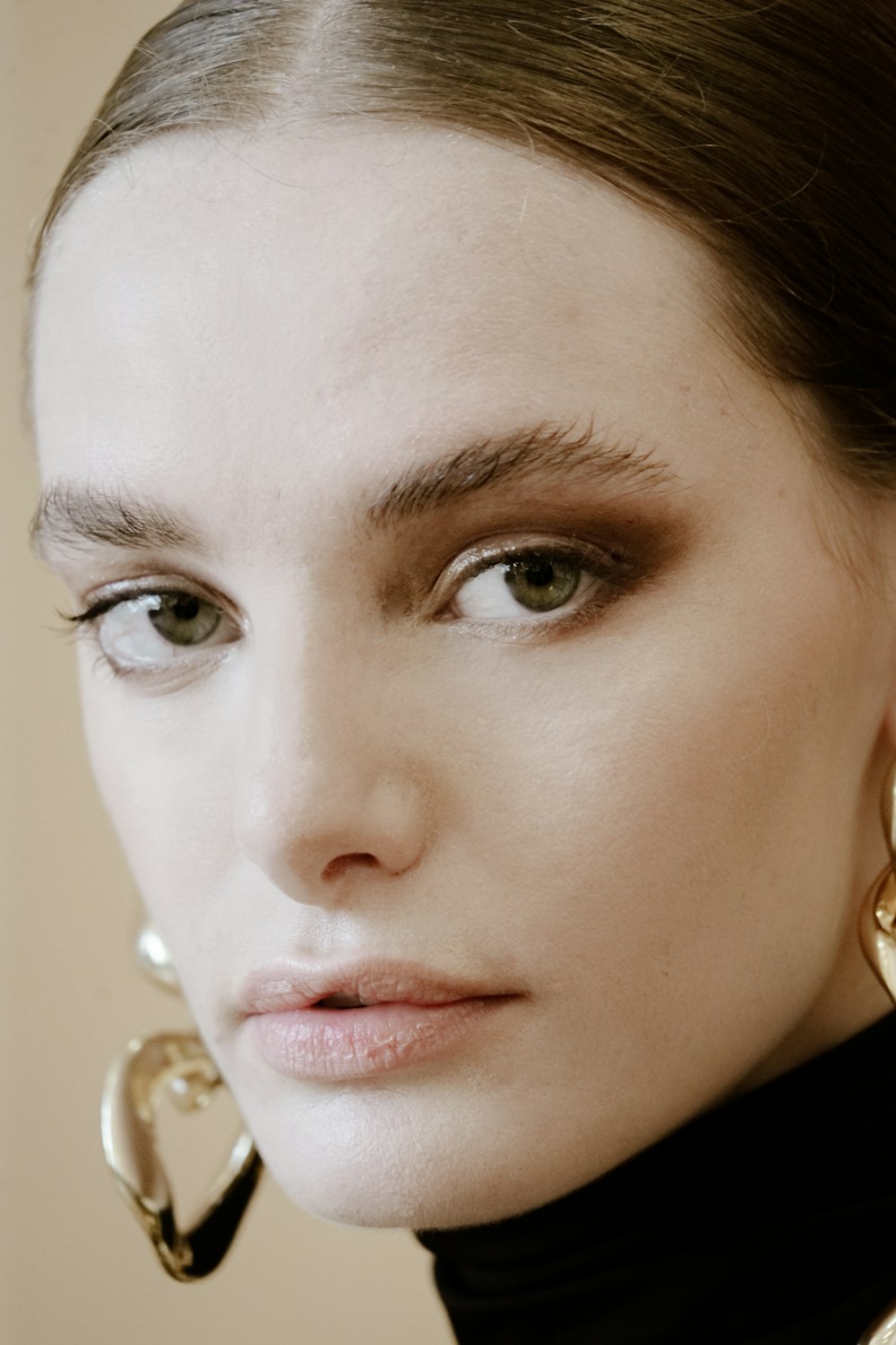 a close up of a person wearing earrings