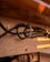 Close-up of a sturdy connectivity box neatly organizing cables on a wooden desk.