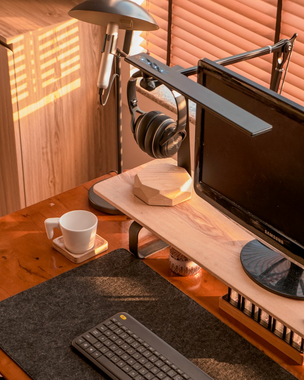 a computer desk with a keyboard, mouse and monitor