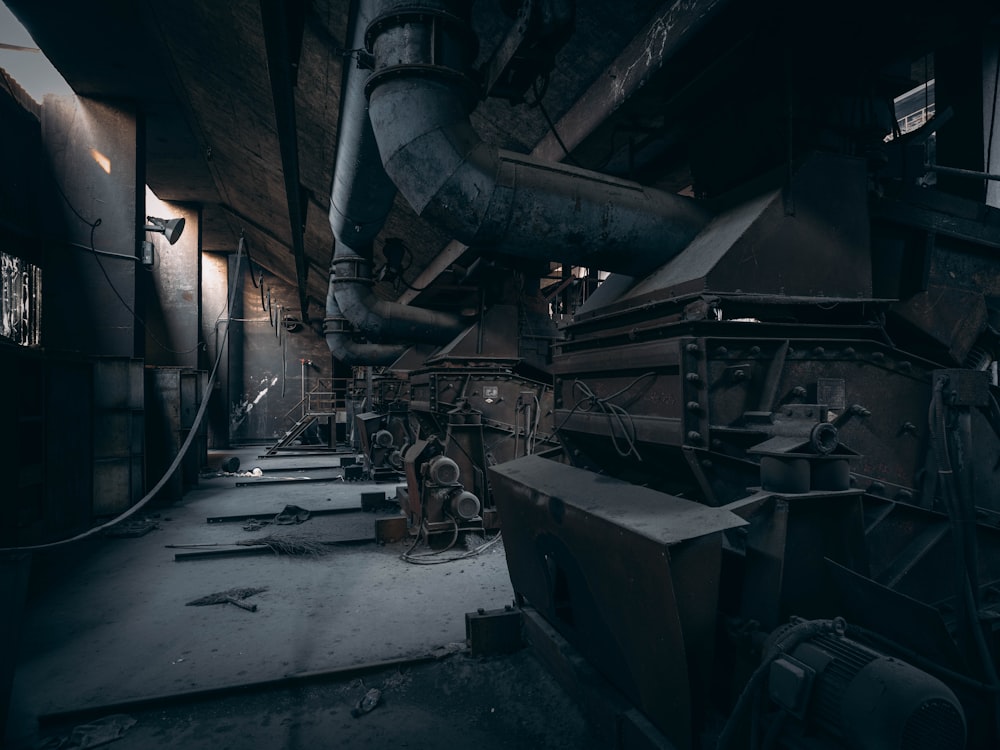 a large industrial building with pipes and machinery