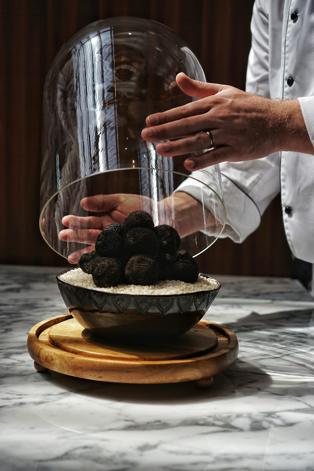 a person holding a bowl with food inside of it