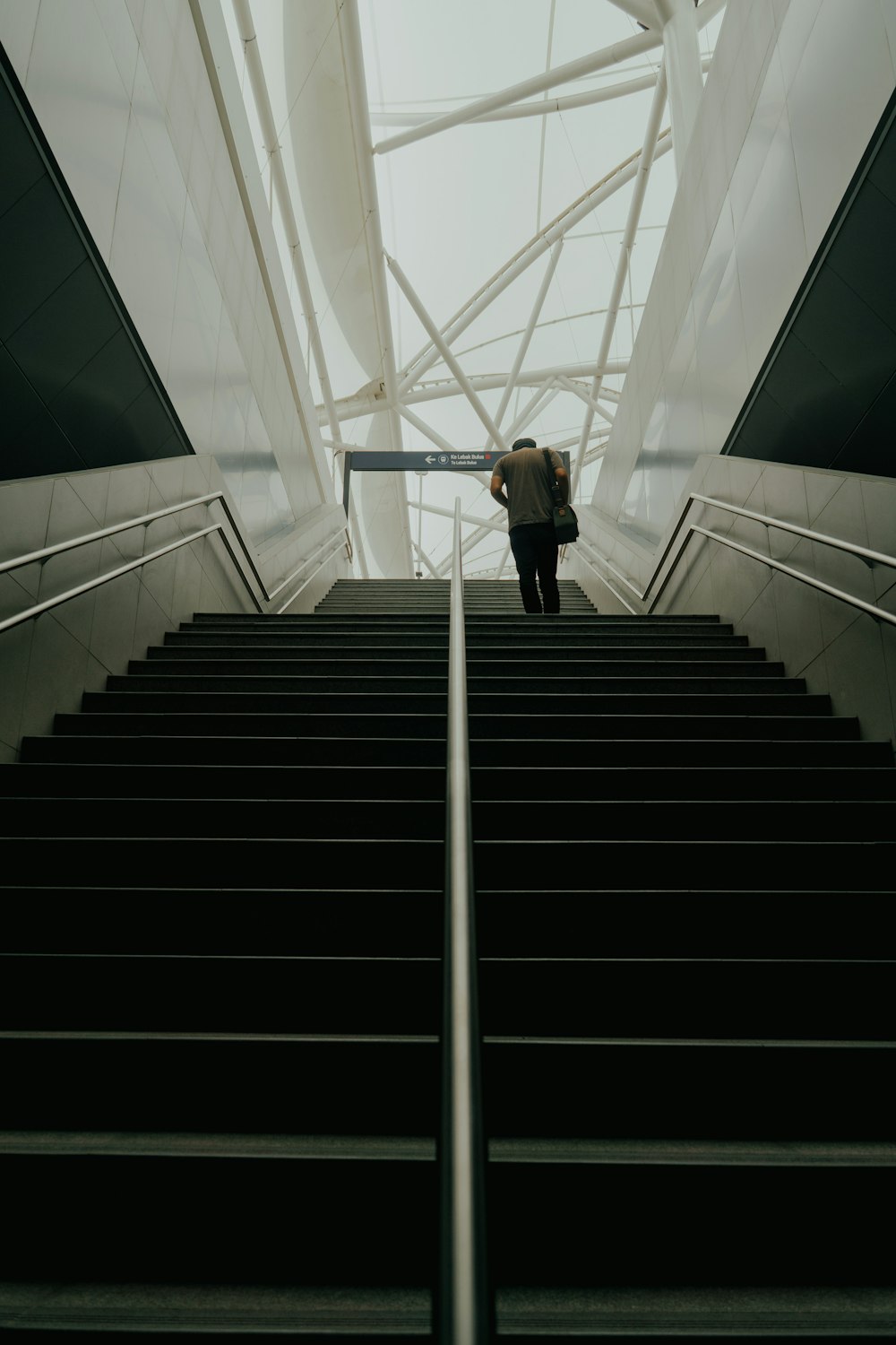 a man walking up a flight of stairs