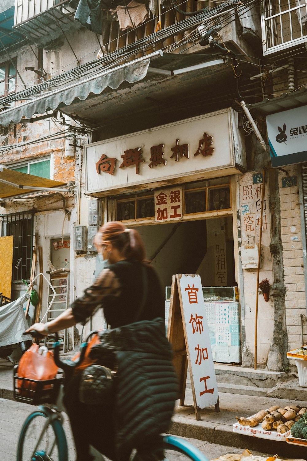 a person riding a bike down a street