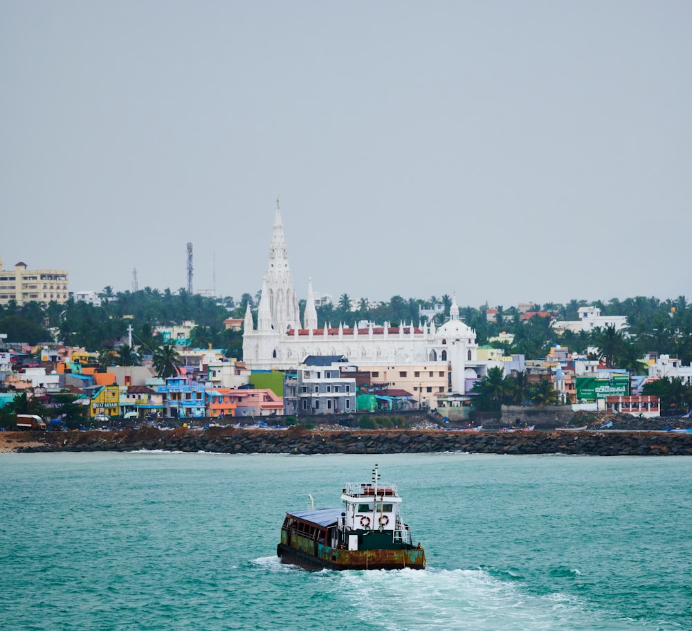 a small boat traveling across a large body of water