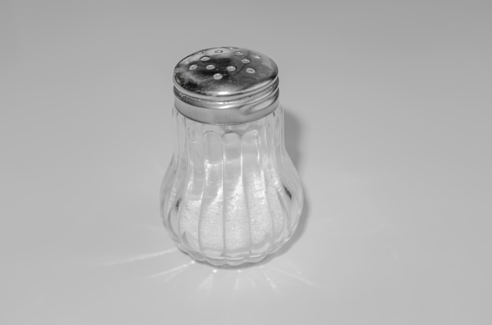 a salt shaker sitting on top of a table
