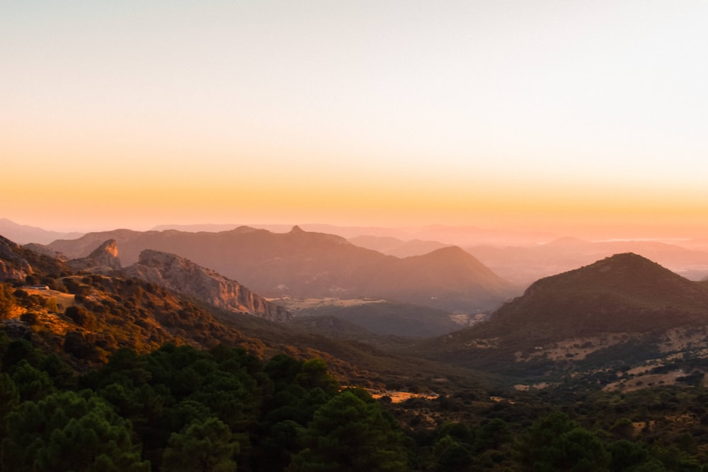 a view of a mountain range at sunset