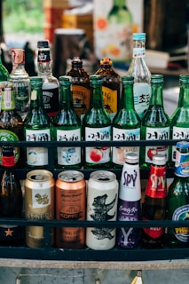 a bunch of different types of beer bottles
