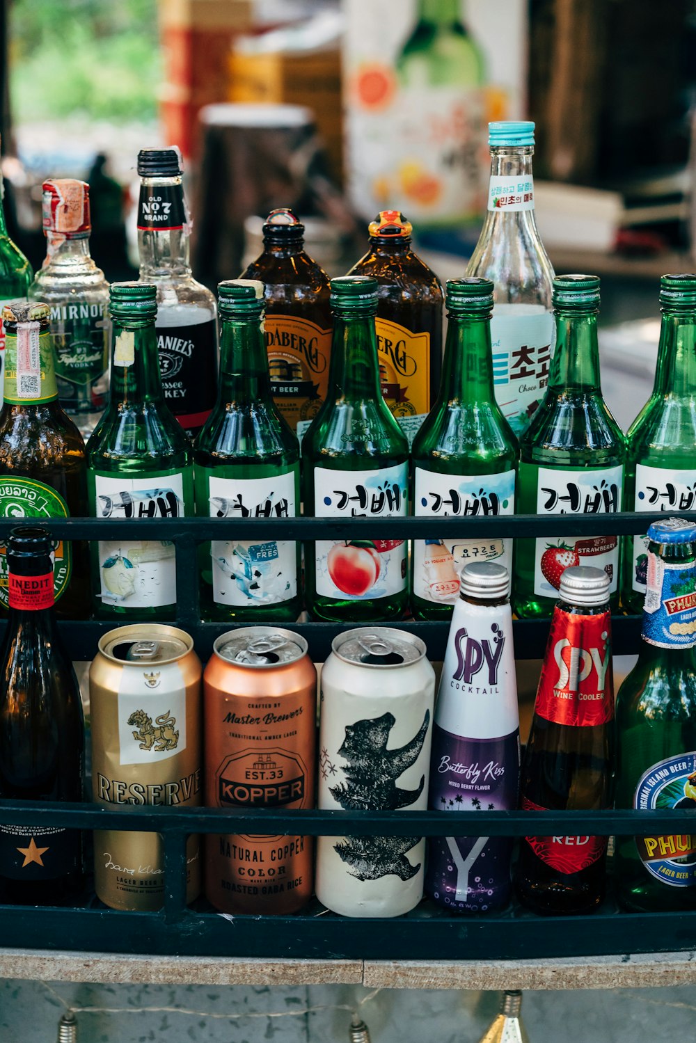 a bunch of different types of beer bottles