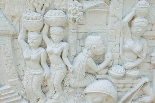 a close up of a carving of a group of people