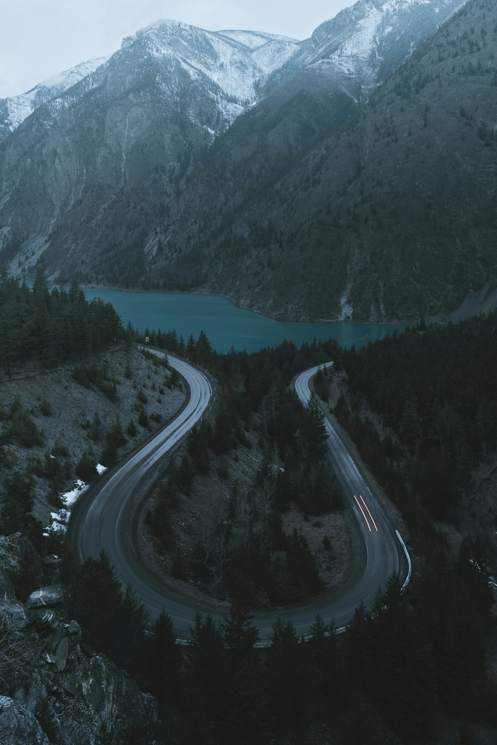 a winding road in the middle of a mountain range