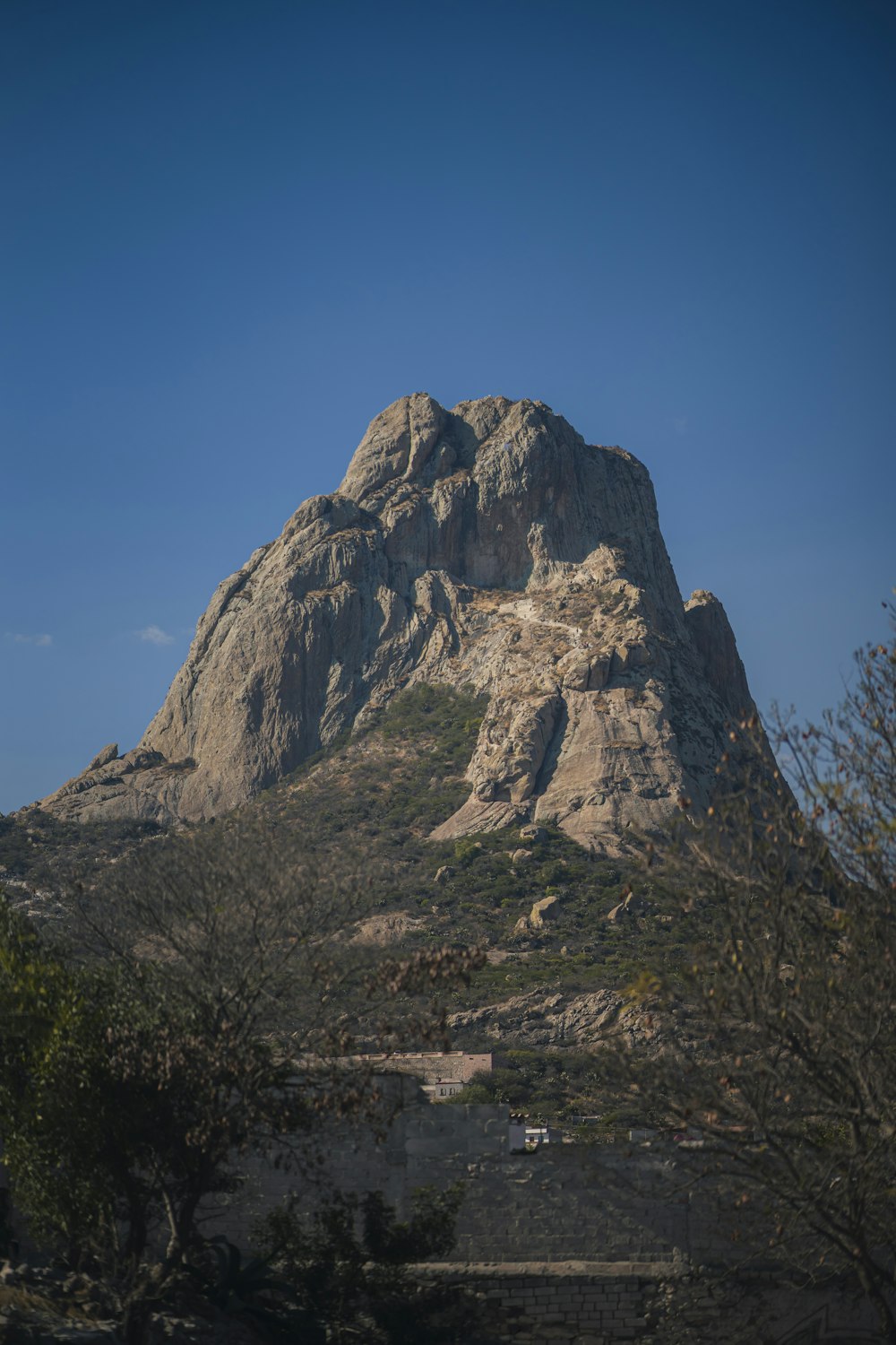 a very tall mountain with a sky background