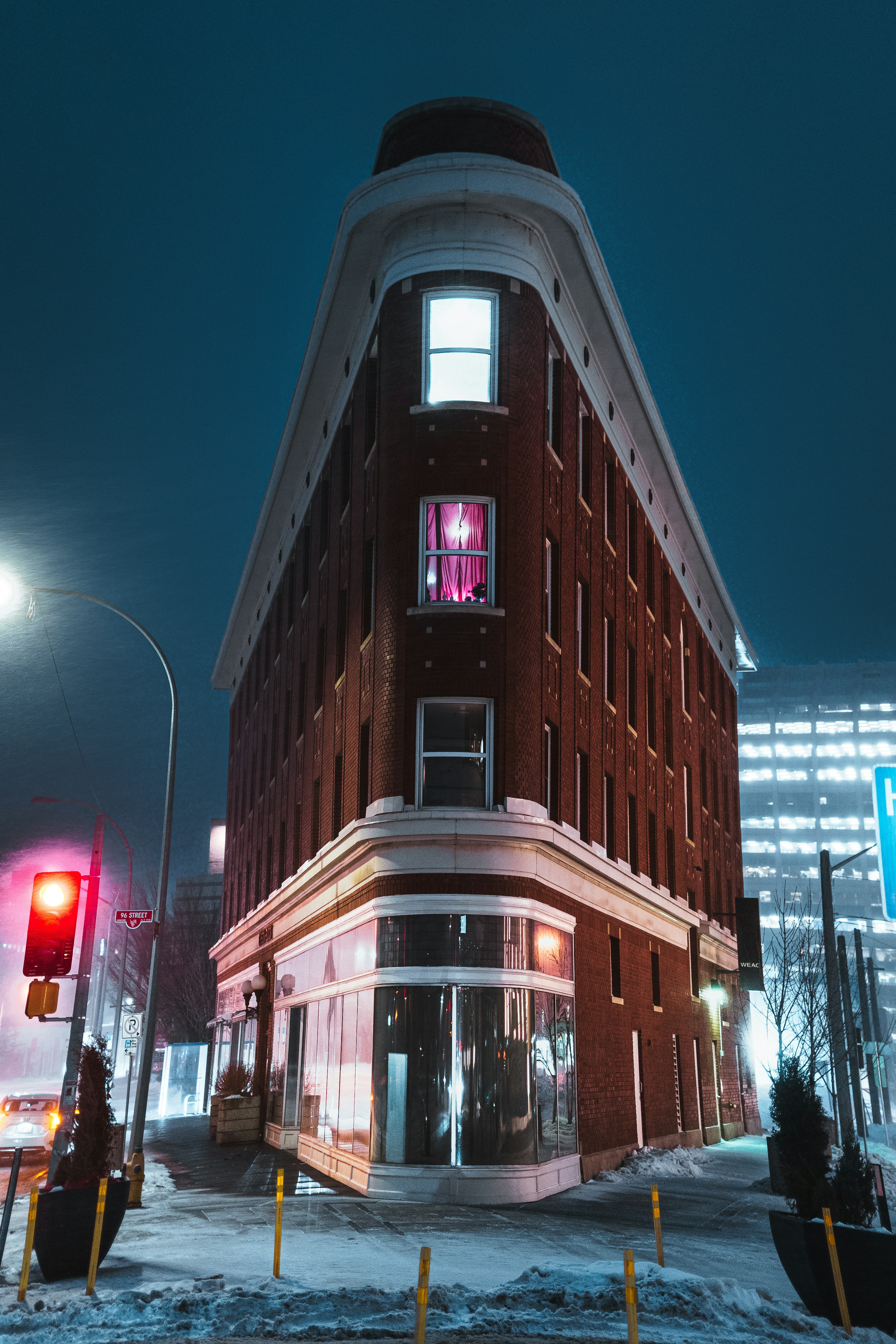 a building with a red traffic light in front of it