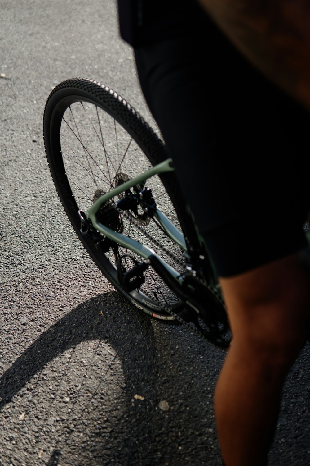 a person riding a bike down a street