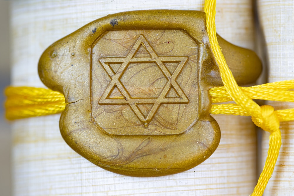 a wooden object with a star of david on it