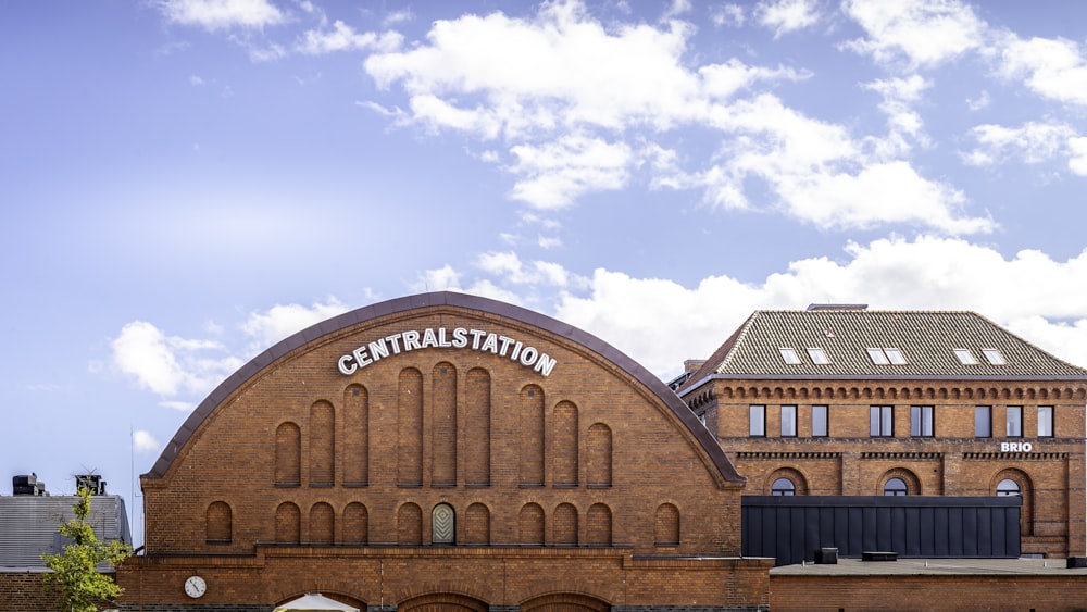 a large brick building with a sky background