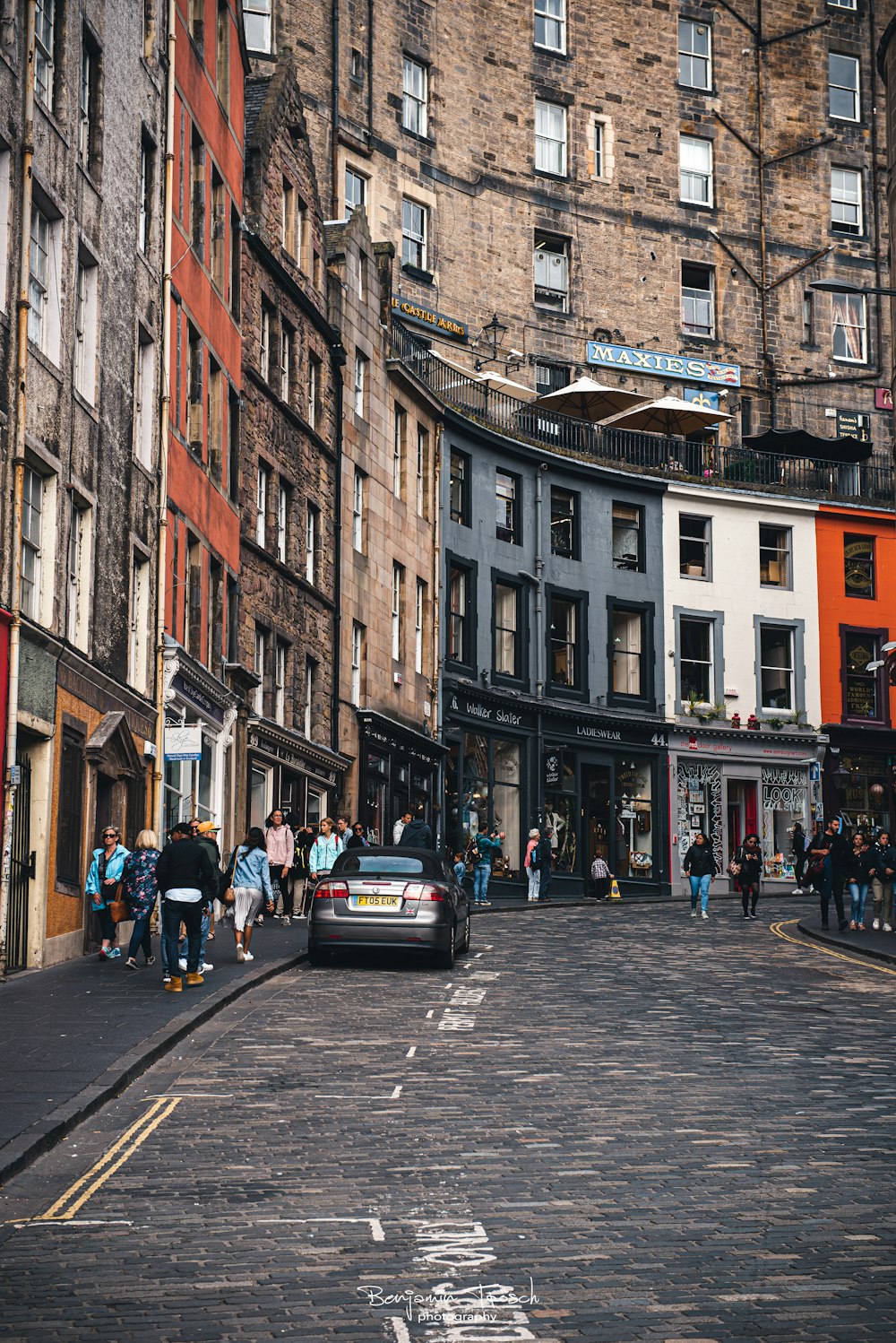 a city street filled with lots of tall buildings